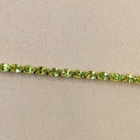 12.72 Ct.Tw. Peridot Tennis/Riviere Bracelet, 18K Yellow Gold Image