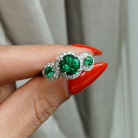 1.64 Ct. Emerald Emerald Three Stone Ring, 18K White Gold Life Style