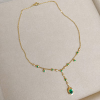 0.73 Ct. Emerald Emerald Accent Stones Necklace, 18K Yellow Gold Life Style