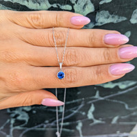 0.72 Ct. Blue Sapphire and Natural Diamond Bezel Pendant, 14K White Gold Life Style