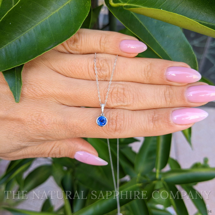 0.72 Ct. Blue Sapphire and Natural Diamond Bezel Pendant, 14K White Gold