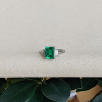 2.62 Ct. Emerald and Natural Diamond Three Stone Ring, Platinum 950 Life Style