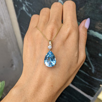 13.33 Ct. Blue Topaz and Natural Diamond Accent Stones Pendant, 14K Yellow Gold Life Style