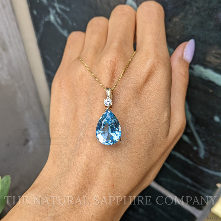 13.33 Ct. Blue Topaz and Natural Diamond Accent Stones Pendant, 14K Yellow Gold