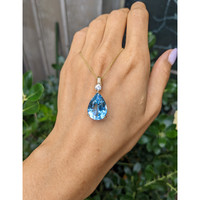 13.33 Ct. Blue Topaz and Natural Diamond Accent Stones Pendant, 14K Yellow Gold Life Style