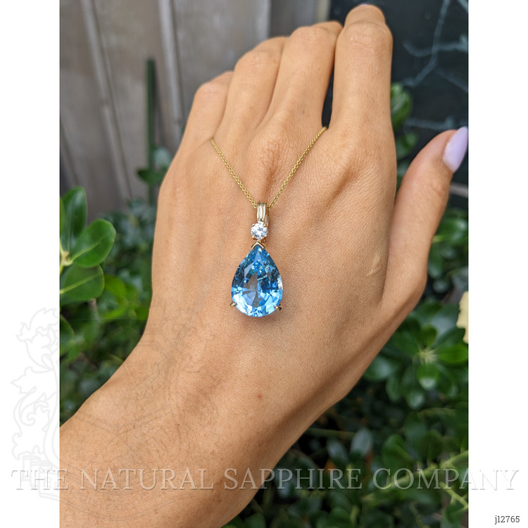 13.33 Ct. Blue Topaz and Natural Diamond Accent Stones Pendant, 14K Yellow Gold