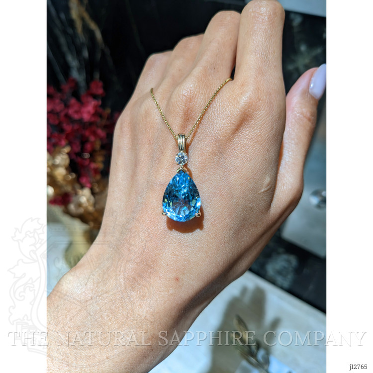 13.33 Ct. Blue Topaz and Natural Diamond Accent Stones Pendant, 14K Yellow Gold