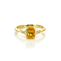 0.98 Ct. Orangish Yellow Sapphire and Natural Diamond Three Stone Ring, 14K Yellow Gold Video