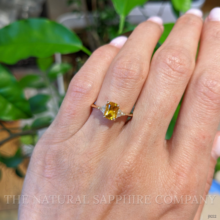 0.98 Ct. Orangish Yellow Sapphire and Natural Diamond Three Stone Ring, 14K Yellow Gold