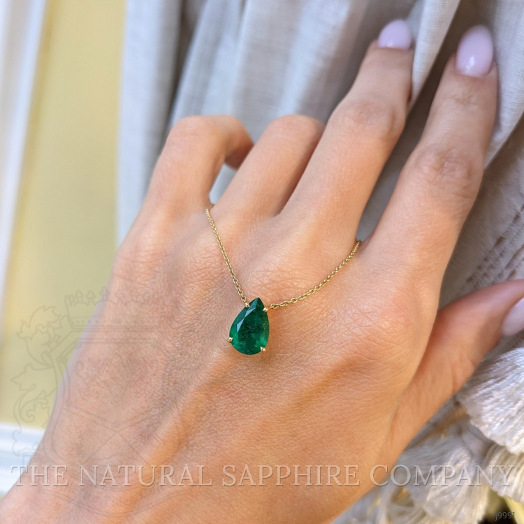 1.56 Ct. Emerald Halo Pendant, 14K Yellow Gold