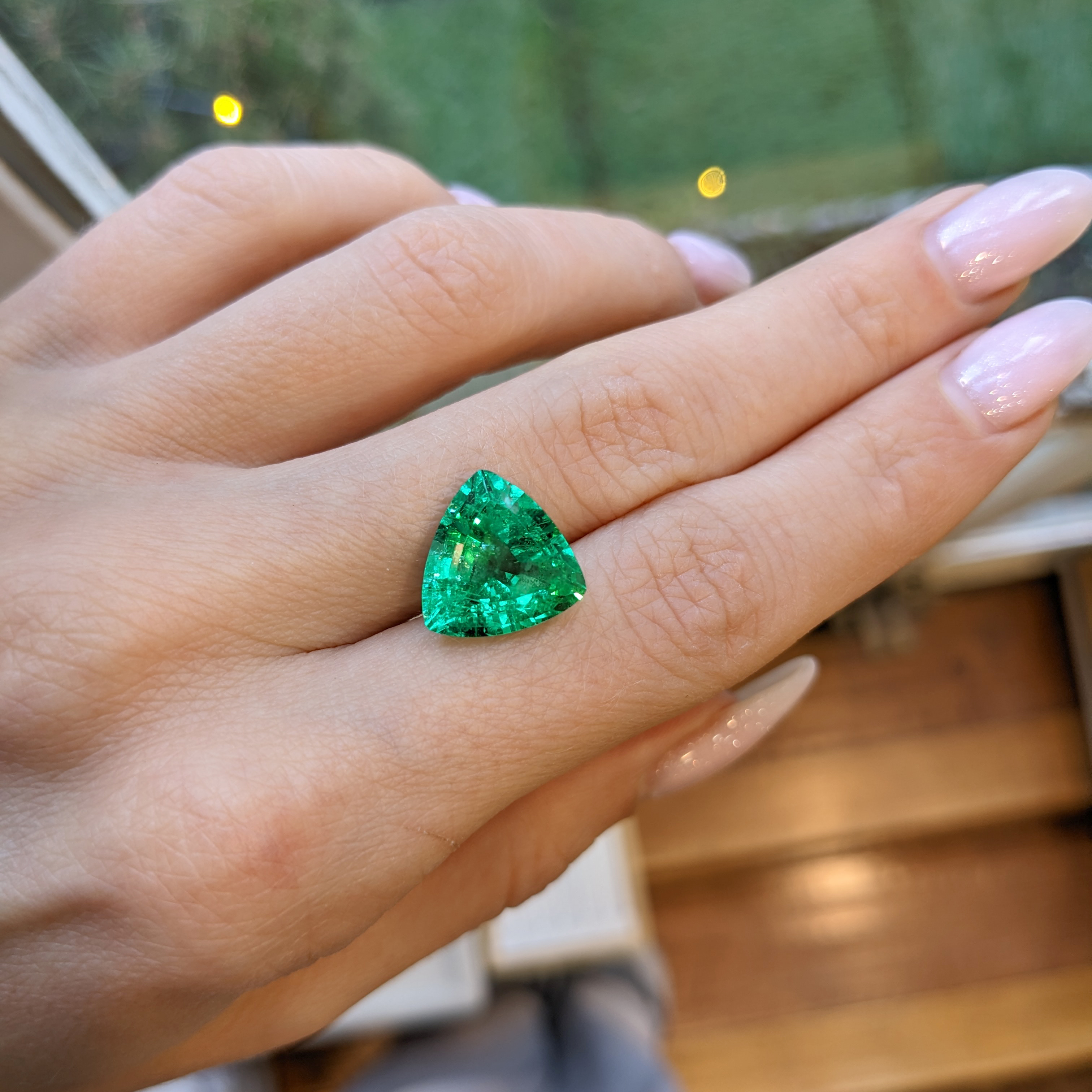 Trillion cut emerald on sale ring