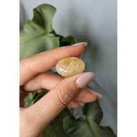 23.70 Ct. Cabochon Rutilated Quartz from Madagascar Life Style