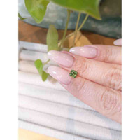 0.77 Ct. Demantoid Garnet from Namibia Life Style