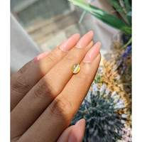 1.44 Ct. Greenish Yellow Cabochon Chrysoberyl from Madagascar Life Style