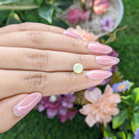 2.11 Ct. Greenish Yellow Cabochon Chrysoberyl from Madagascar Life Style