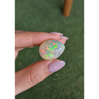 21.14 Ct. Multi Color Cabochon Semi-Black Opal from Ethiopia Life Style