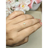 0.57 Ct. Greenish Yellow Cabochon Chrysoberyl from Ceylon (Sri Lanka) Life Style