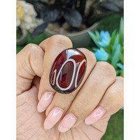 56.31 Ct. Red Cabochon Hessonite Garnet Life Style