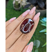 56.31 Ct. Red Cabochon Hessonite Garnet Life Style