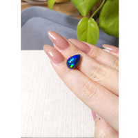 4.15 Ct. Multi Color Cabochon Black Opal from Ethiopia Life Style