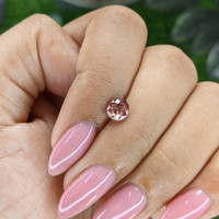 0.73 Ct. Orangish Pink Malaya Garnet from Tanzania Life Style