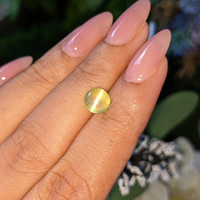 2.06 Ct. Yellowish Green Cabochon Chrysoberyl from Tanzania Life Style