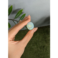 24.81 Ct. Multi Color Cabochon White Opal from Ethiopia Life Style
