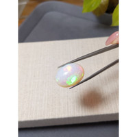 18.61 Ct. Multi Color Cabochon White Opal from Ethiopia Life Style