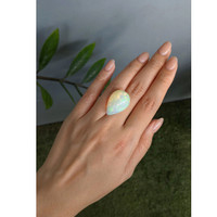 20.51 Ct. Multi Color Cabochon White Opal from Ethiopia Life Style