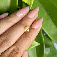 2.12 Ct. Greenish Yellow Cabochon Chrysoberyl from Madagascar Life Style
