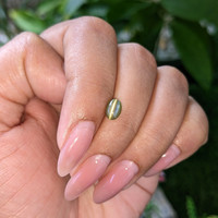 1.14 Ct. Yellowish Green Cabochon Chrysoberyl from Tanzania Life Style
