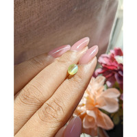 1.35 Ct. Greenish Yellow Cabochon Chrysoberyl from Tanzania Life Style