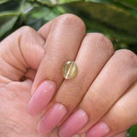 1.76 Ct. Greenish Yellow Cabochon Chrysoberyl from Tanzania Life Style