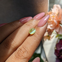 2.10 Ct. Greenish Yellow Cabochon Chrysoberyl from Madagascar Life Style