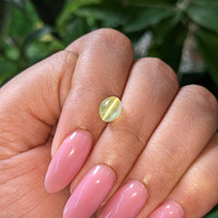 2.10 Ct. Greenish Yellow Cabochon Chrysoberyl from Madagascar Life Style