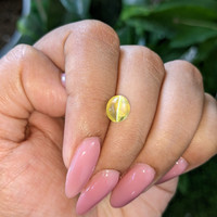 3.33 Ct. Yellowish Green Cabochon Chrysoberyl from Madagascar Life Style