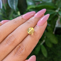 3.33 Ct. Yellowish Green Cabochon Chrysoberyl from Madagascar Life Style