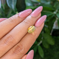 4.55 Ct. Greenish Yellow Cabochon Chrysoberyl from Madagascar Life Style