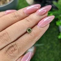 0.32 Ct. Yellowish Green Peridot from Tanzania Life Style