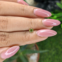 0.28 Ct. Yellowish Green Peridot from Tanzania Life Style