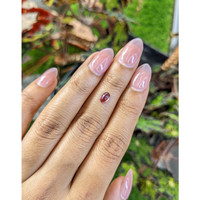 0.55 Ct. Pinkish Purple Cabochon Garnet from Ceylon (Sri Lanka) Life Style