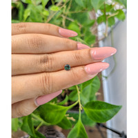 0.59 Ct. Bluish Green Sapphire from Madagascar Life Style
