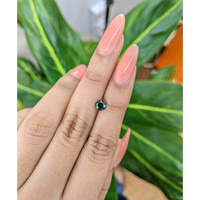 0.79 Ct. Bluish Green Sapphire from Madagascar Life Style