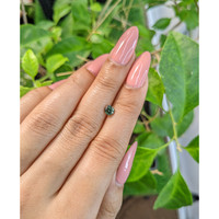0.63 Ct. Bluish Green Sapphire from Madagascar Life Style