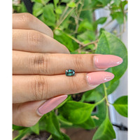 0.83 Ct. Bluish Green Sapphire from Madagascar Life Style