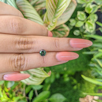 0.94 Ct. Bluish Green Sapphire from Madagascar Life Style