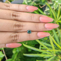 0.94 Ct. Bluish Green Sapphire from Madagascar Life Style