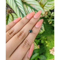 0.95 Ct. Bluish Green Sapphire from Madagascar Life Style