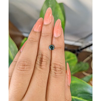 0.95 Ct. Bluish Green Sapphire from Madagascar Life Style
