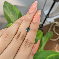 0.83 Ct. Bluish Green Sapphire from Madagascar Life Style